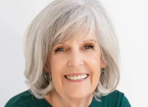 Ann Vanino, Coach - Headshot smiling outdoors